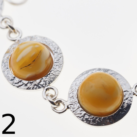 Bransoletka - mleczny bursztyn okrągły i srebro młotkowane