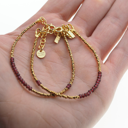 Bransoletka urodzeniowa styczeń - granat, złoty hematyt i srebro złocone