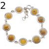 Bransoletka - mleczny bursztyn okrągły i srebro młotkowane