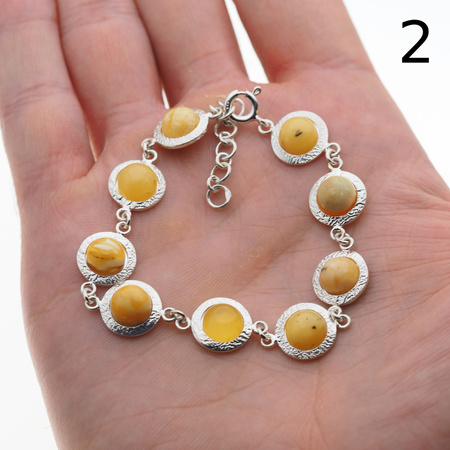 Bransoletka - mleczny bursztyn okrągły i srebro młotkowane